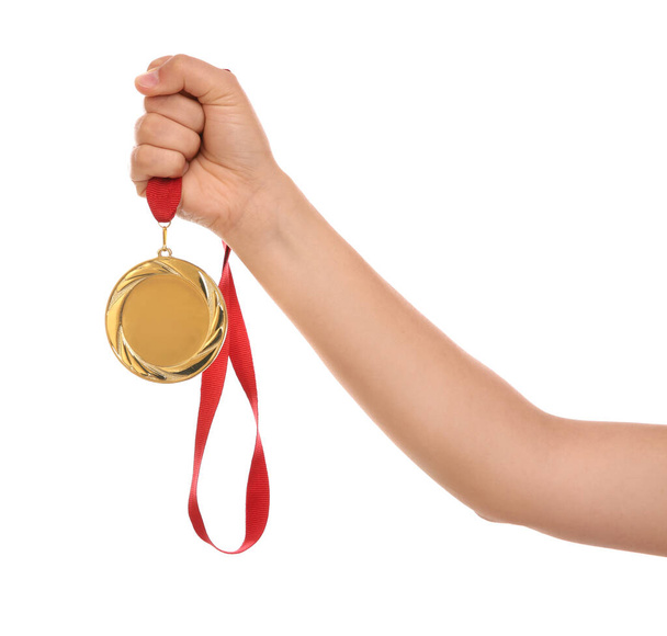 Woman holding gold medal on white background, closeup - Foto, Imagen