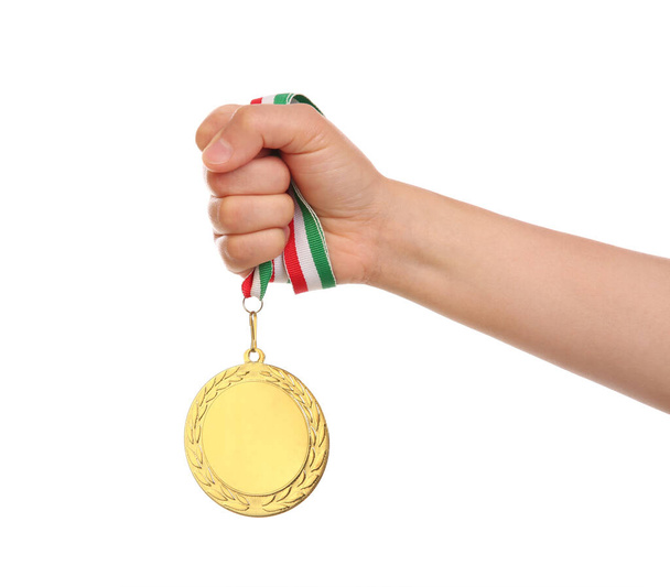 Woman holding gold medal on white background, closeup - Fotoğraf, Görsel