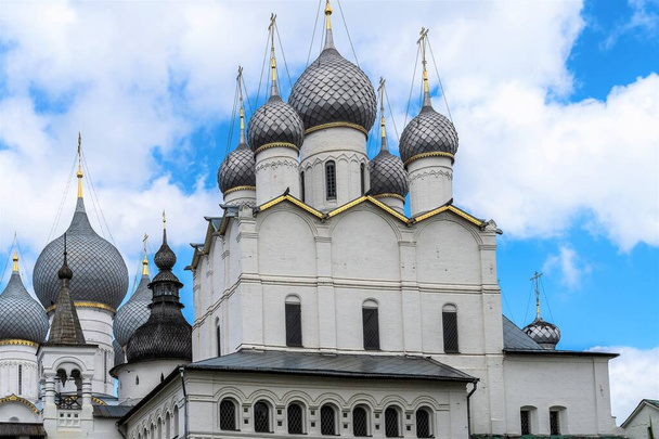 Russia, Rostov, July 2020. Temples of the Rostov Kremlin ensemble against the background of clouds and sky. - Фото, изображение