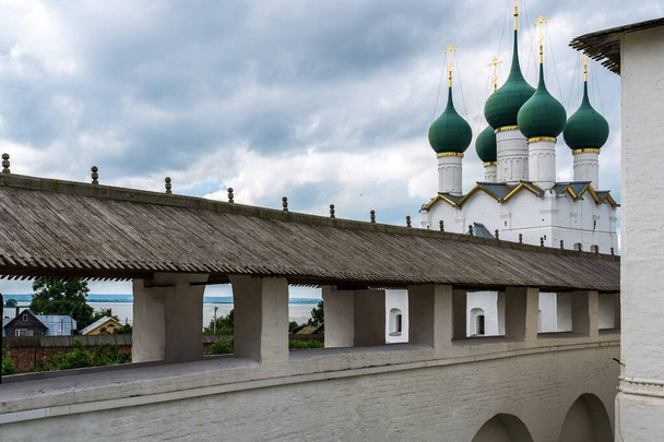 Russia, Rostov, July 2020. View of the covered gallery of the fortress wall and the Orthodox cathedral. - Photo, image