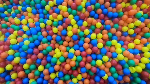 Color pool ball for children. Playtime room background. Rainbow yellow blue plastic balls panorama. Colorful balls for children game. Enjoy Coll life with many small color playground. Children party - Footage, Video