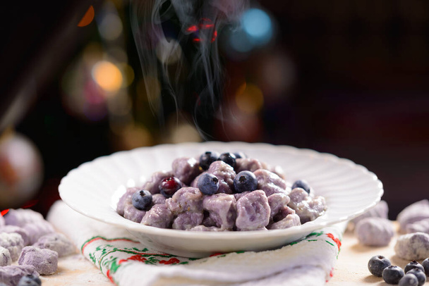 christmas dessert with berries and nuts on a dark background - Foto, Bild