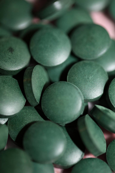 Green pills close up medical spirulina platensis space food modern high quality print - Φωτογραφία, εικόνα