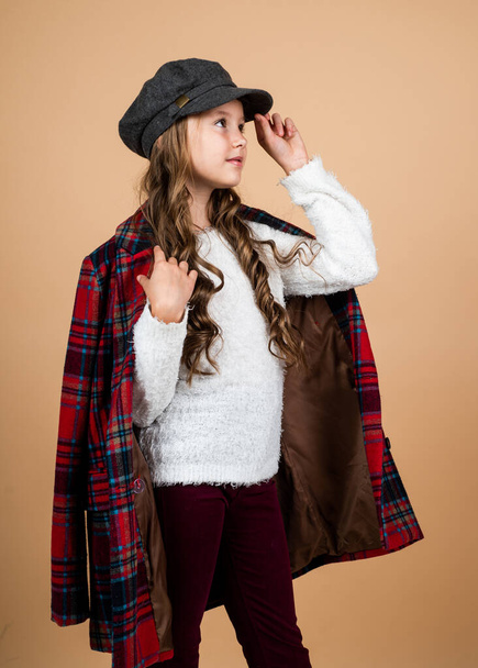 teenage girl in checkered jacket. happy childhood. beauty and fashion. cheerful parisian child has long hairstyle. stylish kid wear trendy french cap. seasonal autumn fashion look - Foto, afbeelding