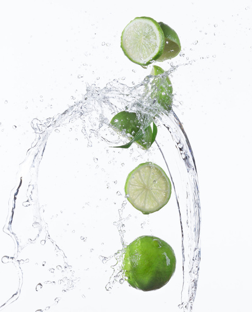 Limes with water splash - Фото, зображення