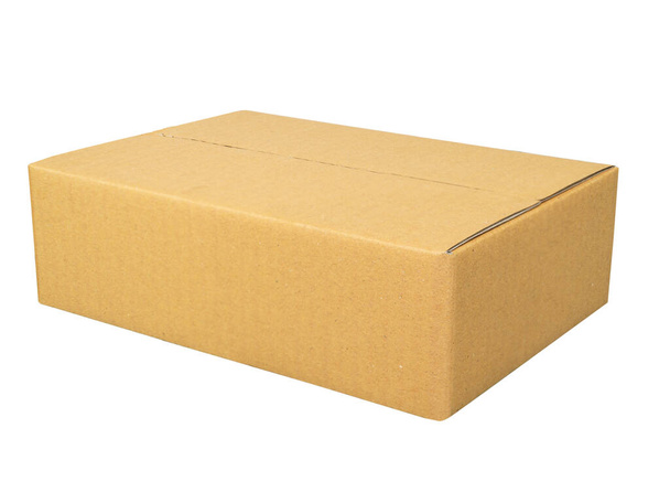 Mockup for design. Closed Brown cardboard box isolated on white background - 写真・画像