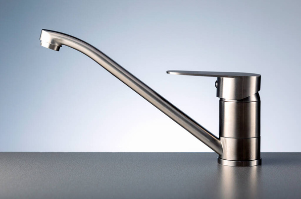 Faucet, chrome stainless metal faucet in bathroom or kitchen. - Foto, imagen