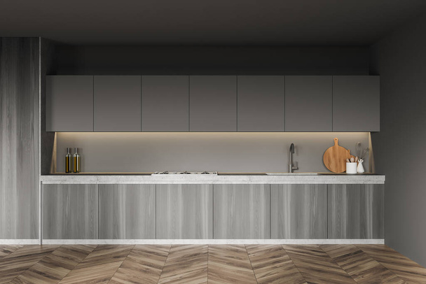 Interior of modern kitchen with gray walls, wooden floor and wooden cupboard. 3d rendering - Photo, Image