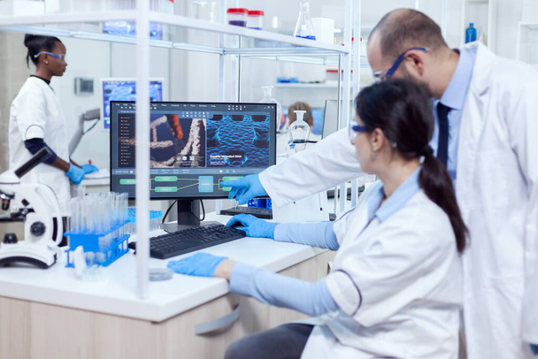 Group of scientist working with computer in laboratory - Photo, Image