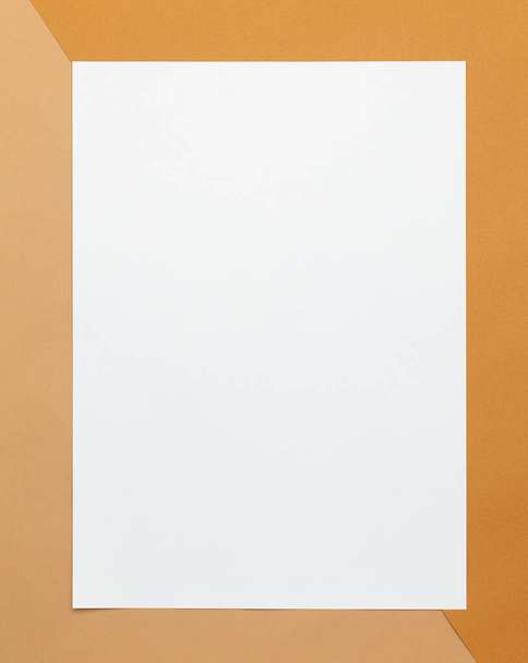 Blank poster brochure a4 size mockup template on half beige and brown background. - Fotografie, Obrázek