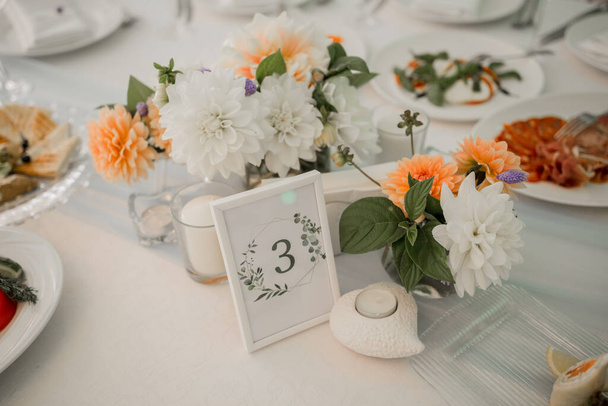 wedding table in restaurant with decor and food - Фото, зображення
