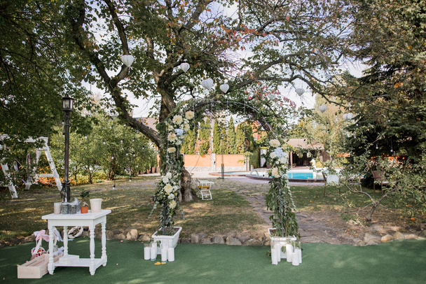 a beautiful wedding arch for ceremony in the park - Photo, image