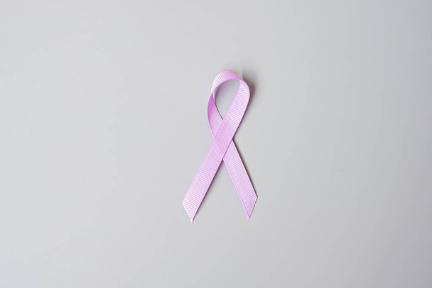 World cancer day (February 4). Lavender purple ribbon for supporting people living and illness. Healthcare and medical concept - Фото, зображення