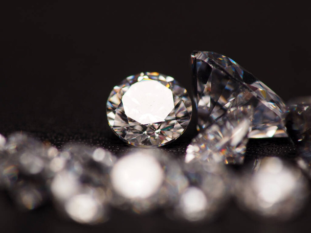 Close up shoot of group of sparkling diamonds, shoot on black leather as background - Photo, Image