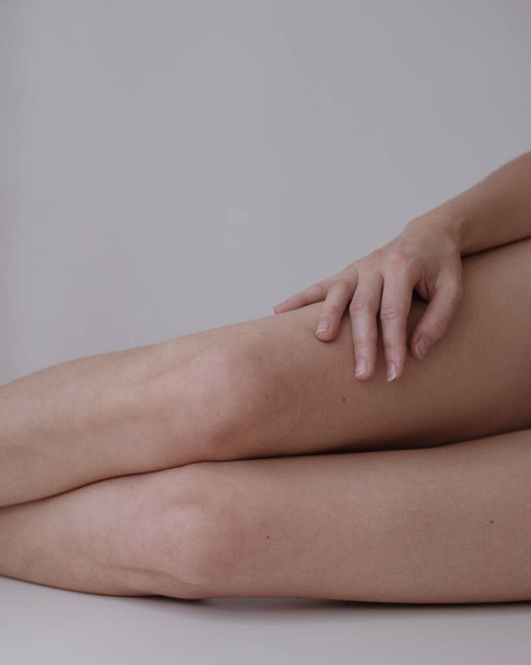 woman knees and hands with no retouch - Фото, изображение
