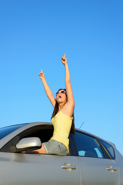 Successful female driver pointing - 写真・画像