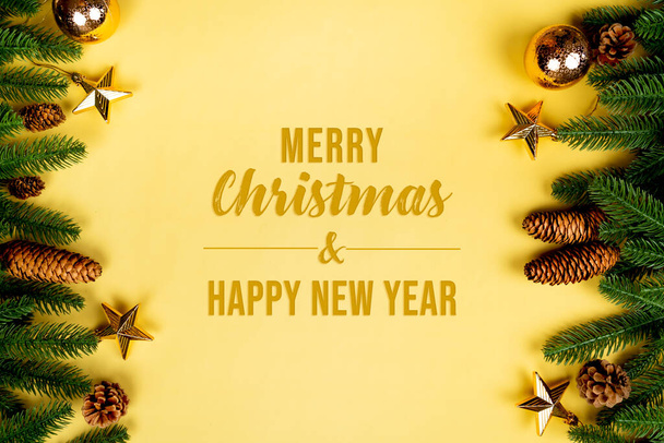 Christmas background, pine tree with xmas decoration on yellow background - Фото, зображення