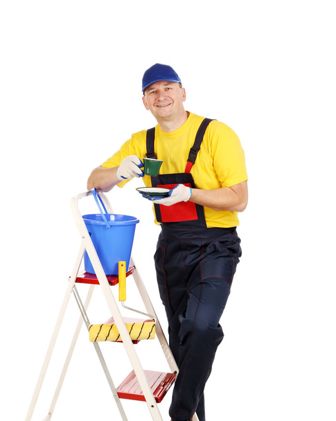 Worker on ladder with cup of tea - Fotó, kép