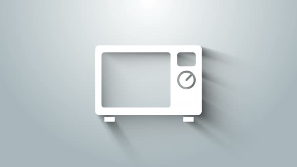 灰色の背景に分離された白い電子レンジのアイコン。家電製品のアイコン。4Kビデオモーショングラフィックアニメーション - 映像、動画