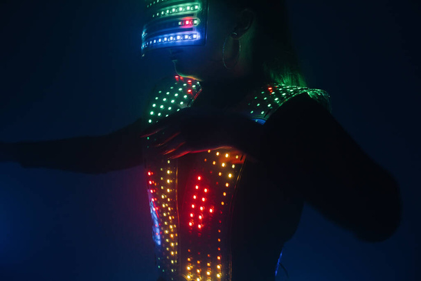 Two sexy disco dancers move in UV costumes. Parties and dances. - Foto, imagen