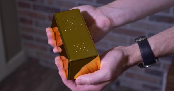 Man Holds Out One Bar of Gold - Footage, Video