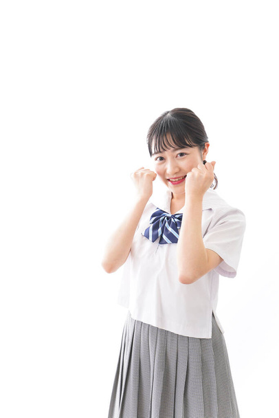 улыбающаяся азиатская студентка в форме  - Фото, изображение