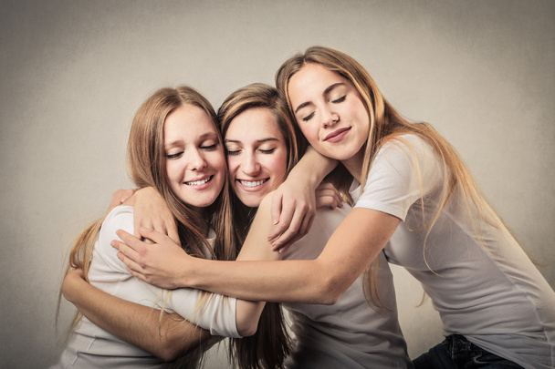 Smiling women hugging - Foto, afbeelding