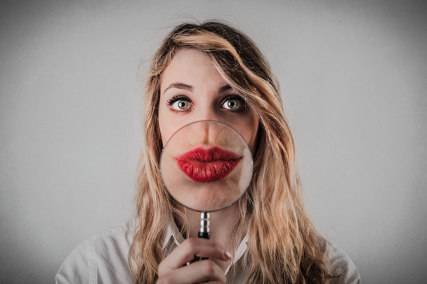 Young woman with a huge red mouth - Photo, Image