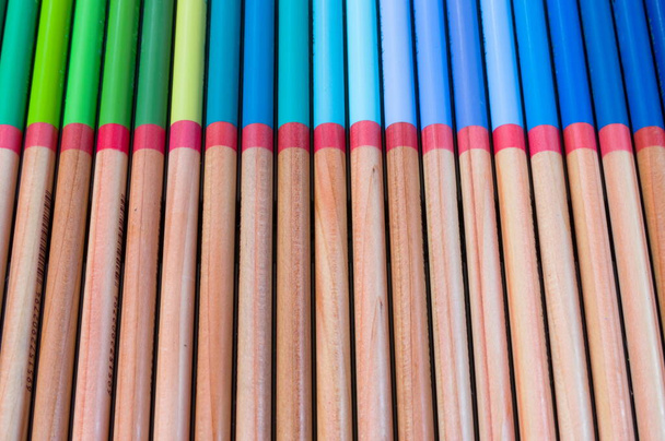 Background from wooden pencils.Set from wooden pencils.The artist's drawing tool. Multi-colored pencils. Pencil point. - Photo, Image