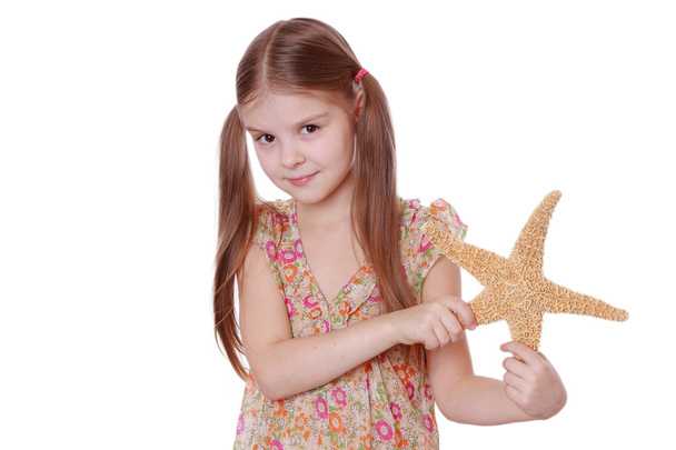 Girl holding a starfish - Photo, Image