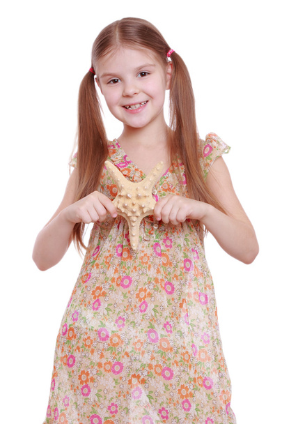 Girl holding a starfish - Fotó, kép