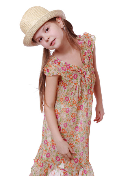 Little girl in summer dress and straw hat - Valokuva, kuva