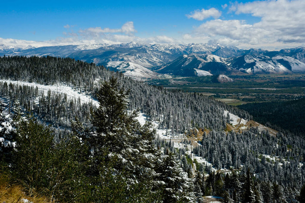 Vista overlooking the southern end of Jackson Hole Wyoming from near the top of Teton Pass Highway with a dusting of early autumn snow - Photo, Image