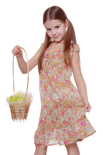 Girl holding basket with Easter eggs - Foto, afbeelding