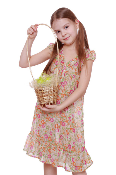 Girl holding basket with Easter eggs - Фото, зображення