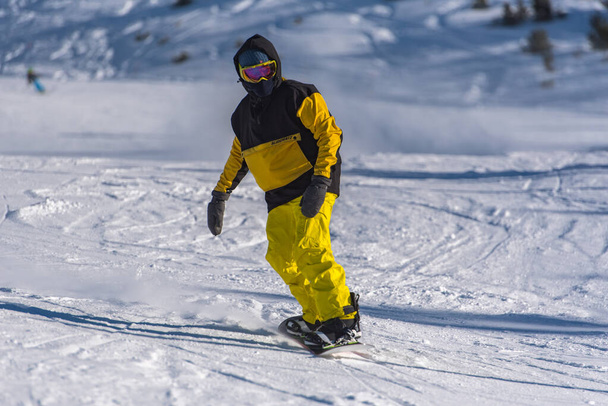 Pas de la Casa, Andorra: 2021 January 03: Young man skiing in the Pyrenees at the Grandvalira ski resort in Andorra in Covid19 time - Фото, изображение