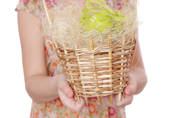 Girl holding basket of Easter eggs - Fotoğraf, Görsel