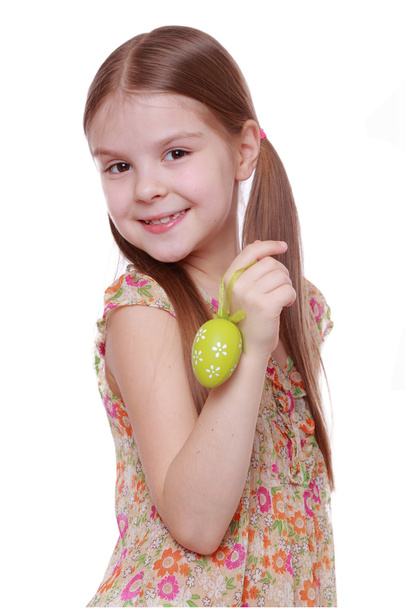 Little girl holding Easter egg - Фото, изображение