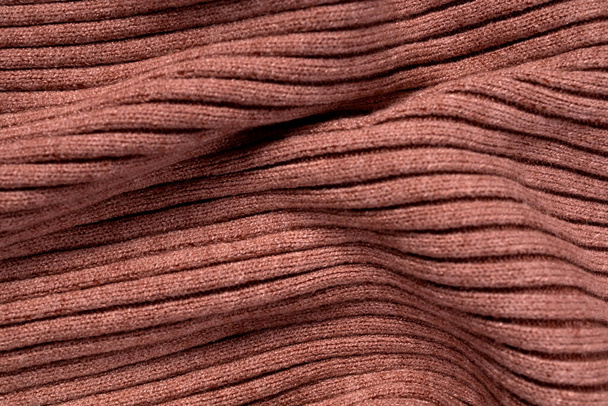 Beige cashmere knit fabric with several folds in different sizes - Foto, Bild