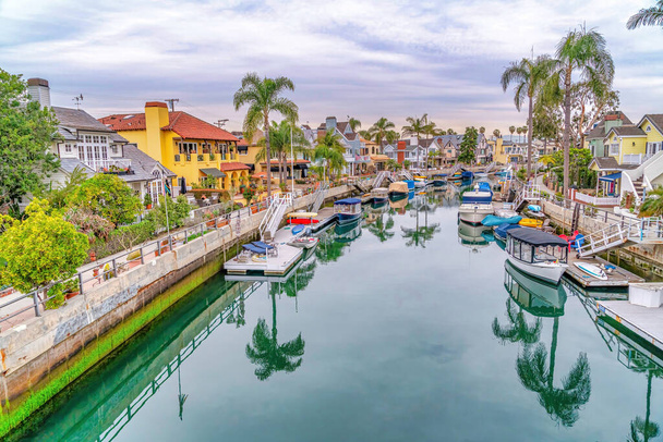 The beautiful canal in Long Beach California with boats and reflection of trees - Photo, Image