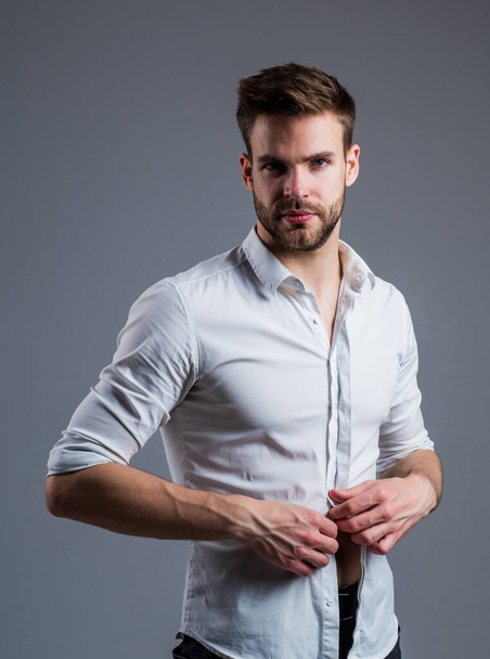 undress me. fashion and beauty. barbershop concept. mens wear. confident businessman. young handsome guy in white office shirt. stylish male wear formal clothes. bearded man with business look - Foto, imagen