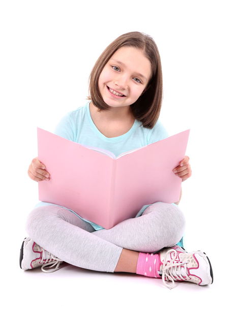 Beautiful little girl with book, isolated on white - Photo, image