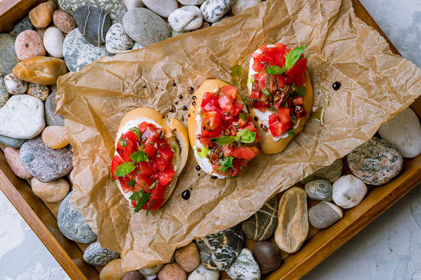 bruschetta with tomatoes and cheese - Фото, зображення