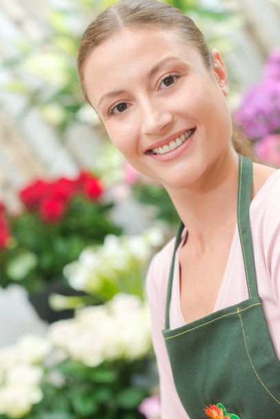 a pretty florist smiling at camera - Photo, image