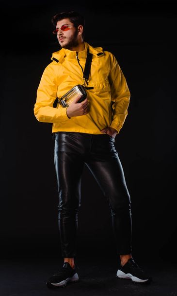 Portrait of a handsome stylish man posing in trendy modern clothing - Fotó, kép