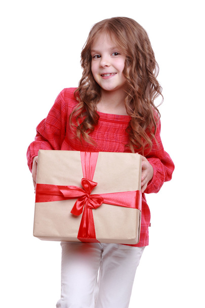 Little girl holding a gift - Photo, Image