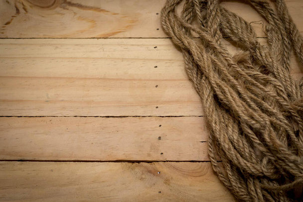 Aged rope on the old wooden pattern background - Фото, изображение