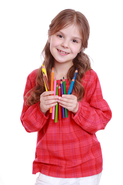 First grader holding colorful pencils - Foto, Imagem