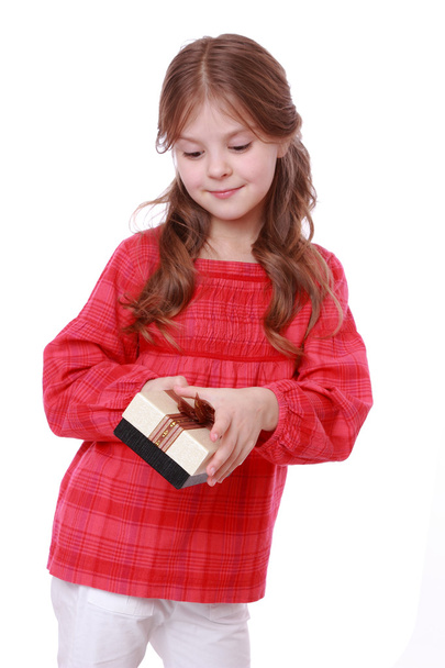 Smiling girl holding present - Фото, зображення