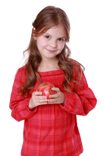 Girl holding pomegranate - Photo, image